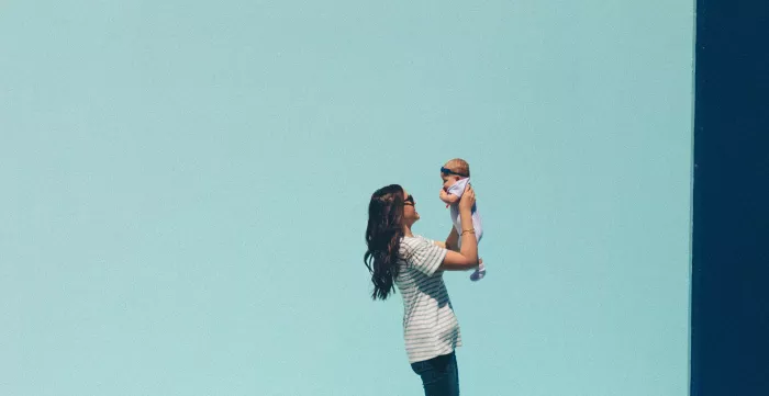 A mother holds her baby