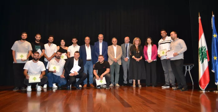 a group picture of trainees during their graduation