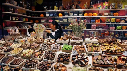 A market stand showing a wide range of produce.