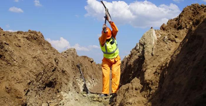 EPWP Worker digging a trench