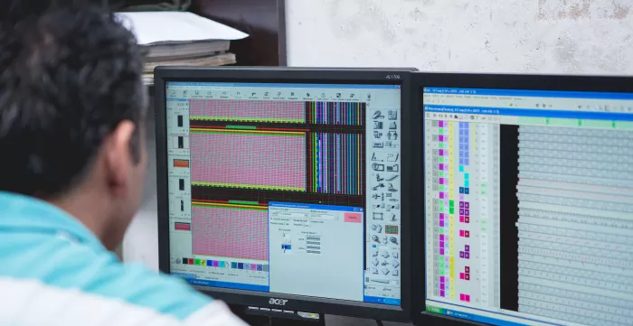 Male worker in front of a computer in Colombia