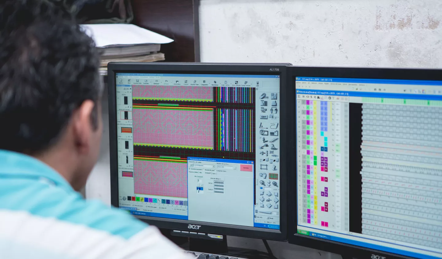 Male worker in front of a computer in Colombia