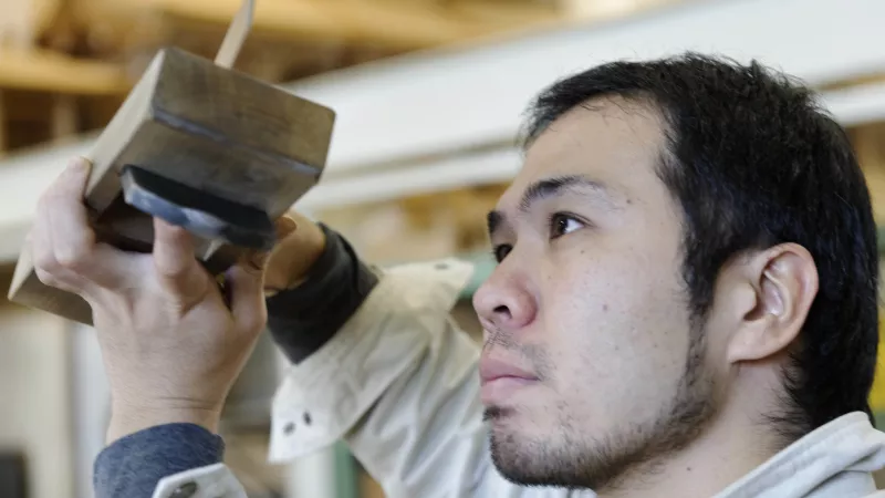 Young man at vocational education and training centre in Japan